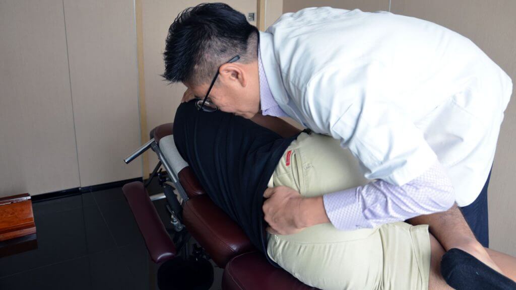 Doctor providing full chiropractic adjustment services